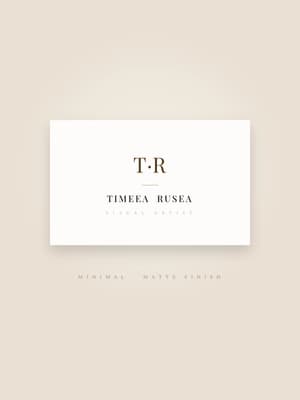 Minimal serif business card in warm cream and brown, matte finish