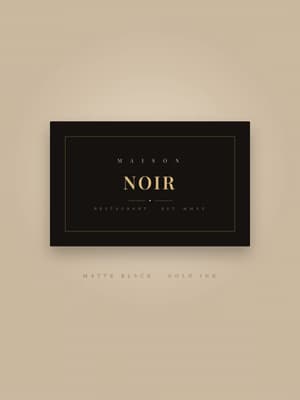 Bold matte-black business card with an elegant gold serif wordmark